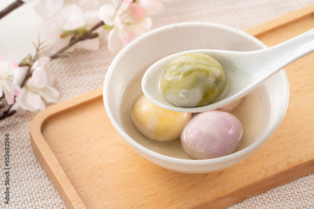 Colored glaze style big tangyuan with cherry blossom flower and syrup soup. Colored glaze style big tangyuan with cherry blossom flower and syrup soup.