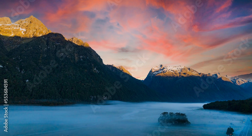 The mountain view of autumn scene and foggy in the morning with sunrise sky scene at fiordland national park