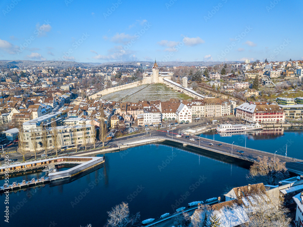 Obraz premium Aerial view of the Swiss old town Schaffhausen in winter, with the medieval castle Munot over the Rhine river. Munot is the landmark of this town.