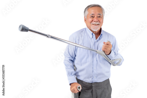 senior person with crutches on white background