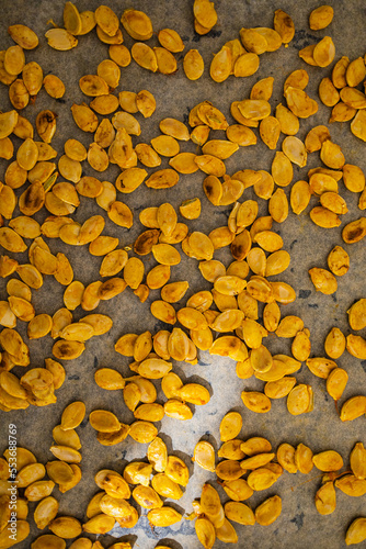 Top down view to a lot of grilled small pumpkin seeds
