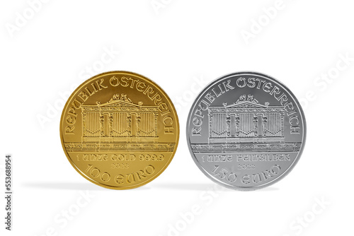 Austrian Silver and Gold Philharmonic Investment Coins on White Background