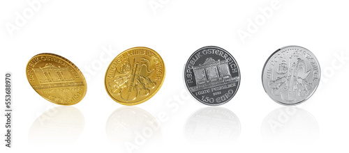 Isolate of golden and silver Austrian  Philharmonic coins in different angles on white background