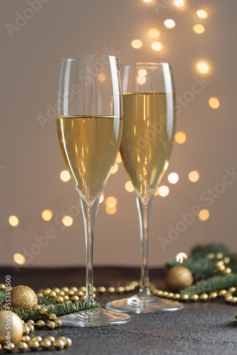 New year's eve, glasses of champagne on black table, Cristmas decoration background