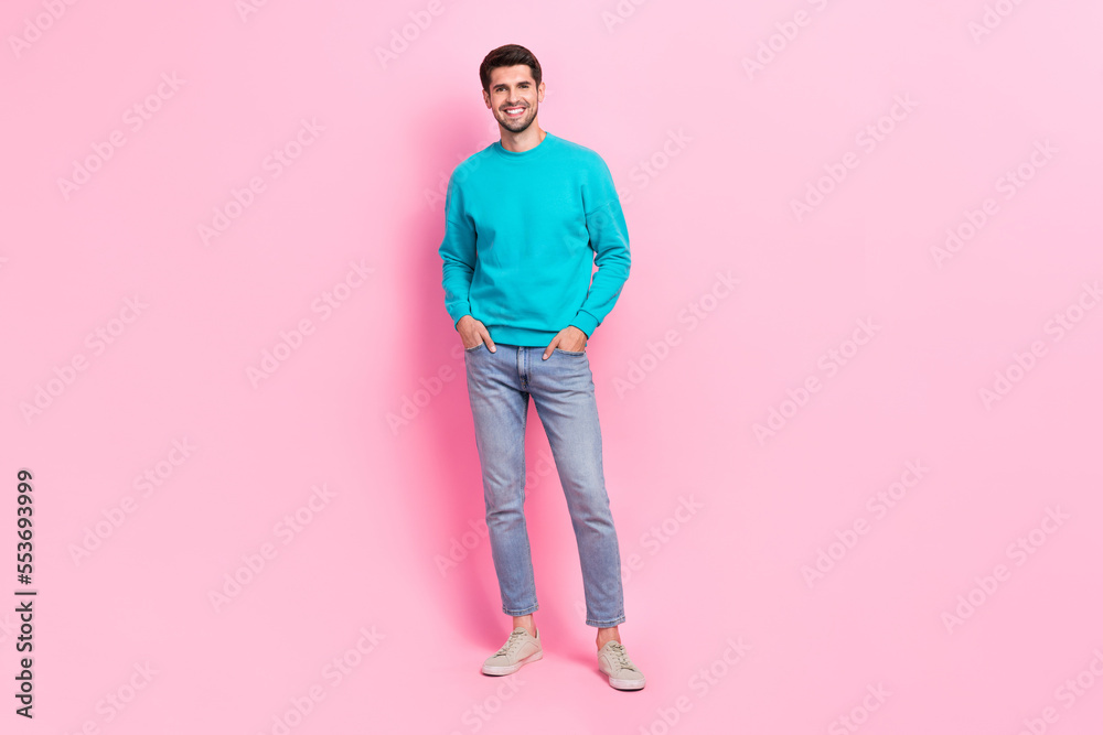 Full size photo of handsome young guy posing shopping banner promo toothy smile wear trendy blue garment isolated on pink color background Full size photo of handsome young guy posing shopping banner promo toothy smile wear trendy blue garment isolated on pink color background