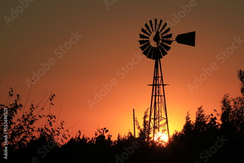windmill at sunset in Kansas.