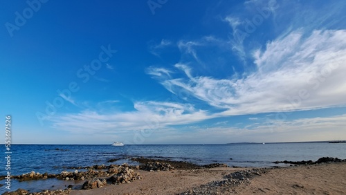 Beach and sea. Blue sky and white clouds 