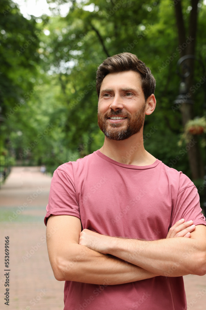 Portrait of handsome bearded man in park Portrait of handsome bearded man in park