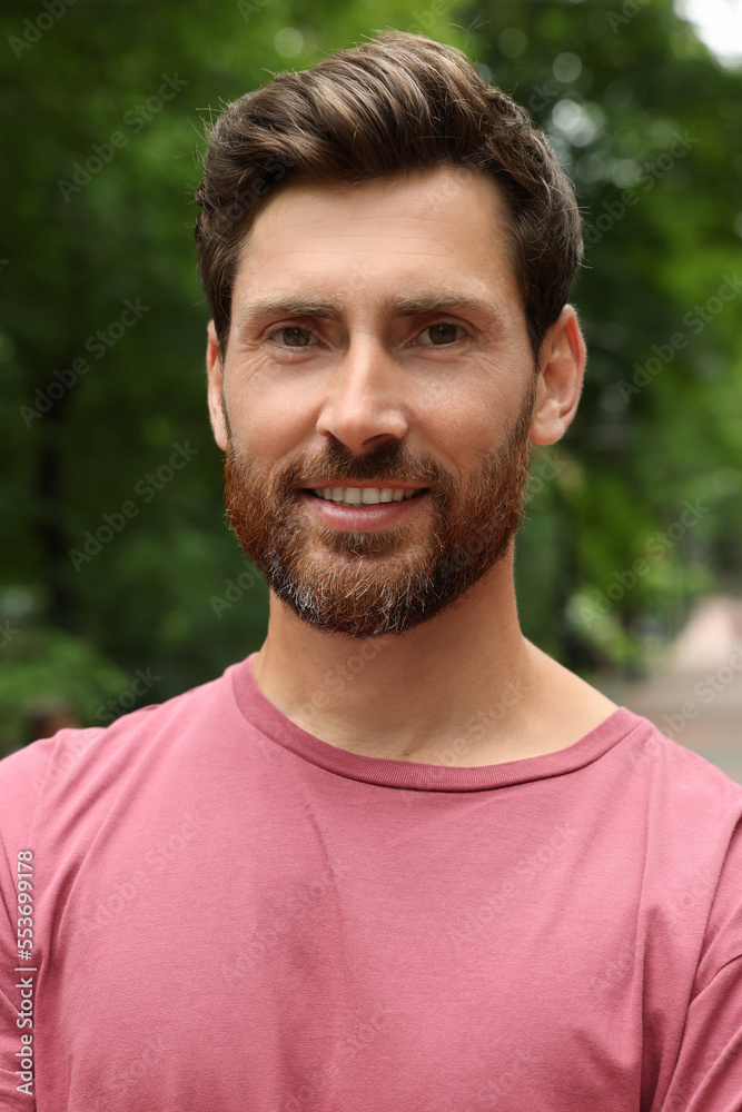 Portrait of handsome bearded man in park Portrait of handsome bearded man in park