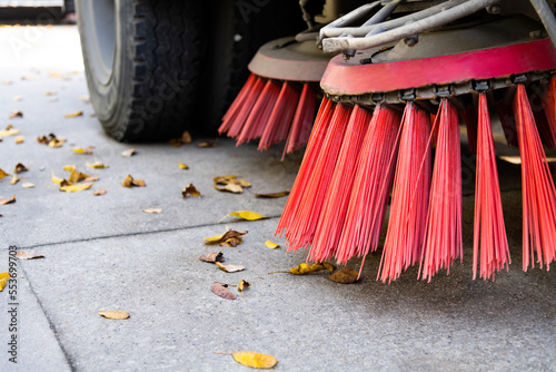 Close up of street sweeper cleaning city street