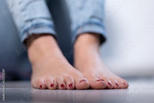 woman feet with red nails close-up