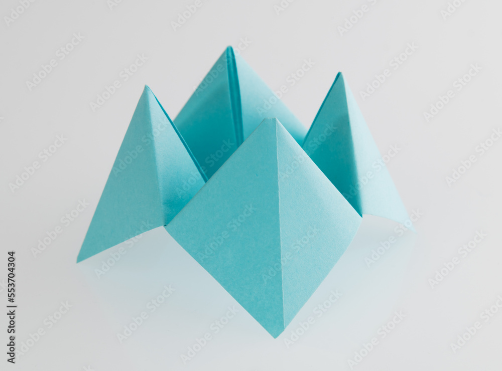 Origami paper fortune on white background Origami paper fortune on white background