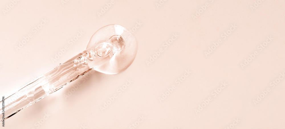 pipette drop of serum test on a beige background pipette drop of serum test on a beige background