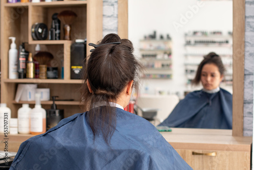Woman ready and waiting to have her hair done at the beauty salon.