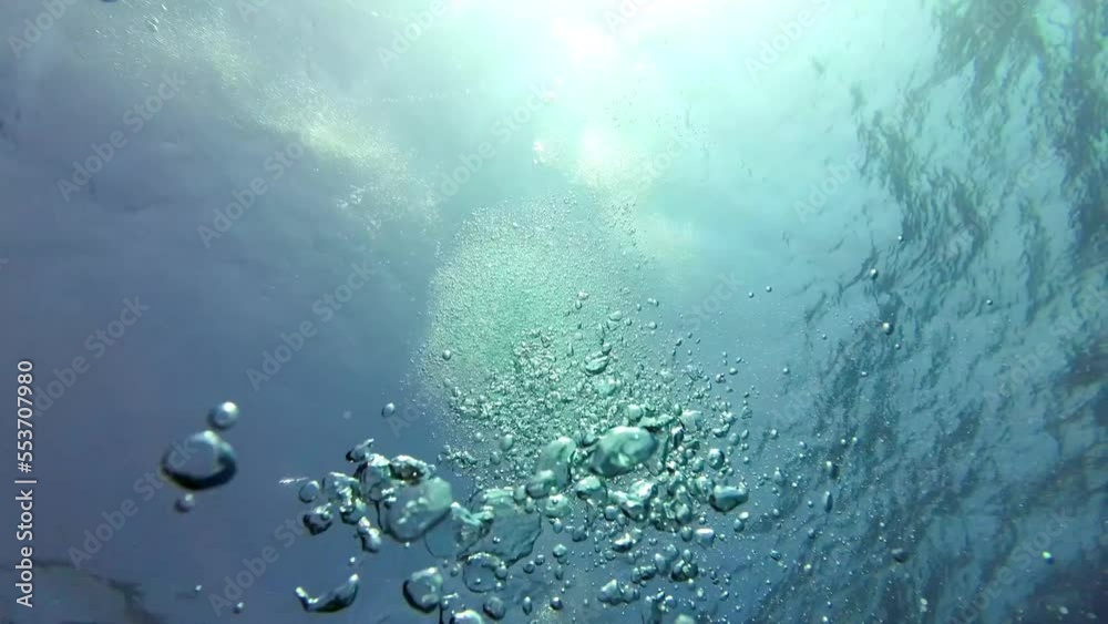 A diver's air bubbles rise to the surface of the water, air bubbles swirl around the camera, Red Sea Egypt A diver's air bubbles rise to the surface of the water, air bubbles swirl around the camera, Red Sea Egypt