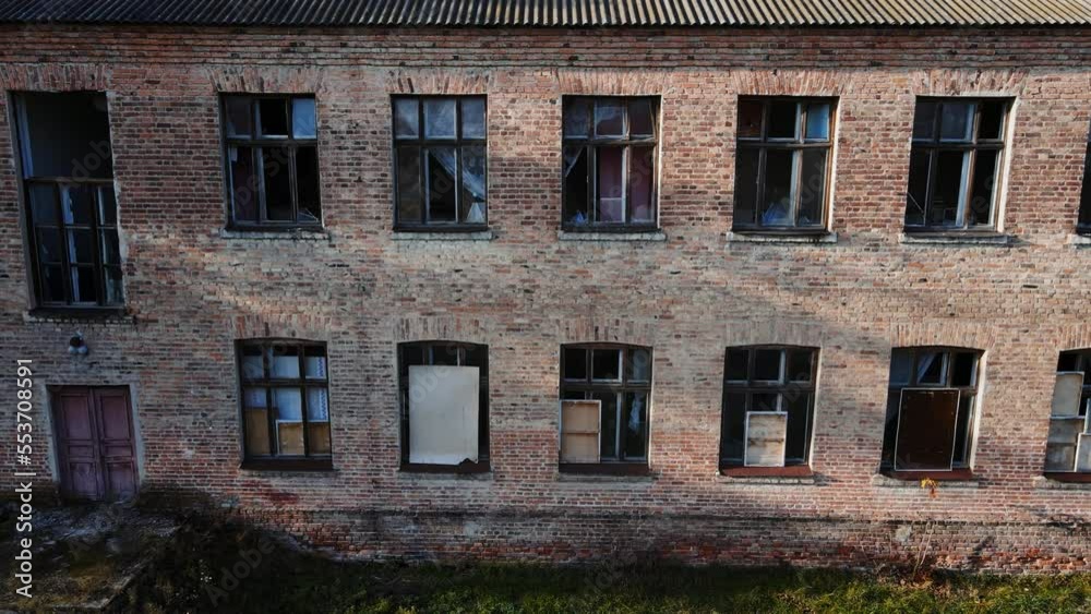 Aerial shot of the destroyed school and broken windows in the building, real war in Ukraine Aerial shot of the destroyed school and broken windows in the building, real war in Ukraine