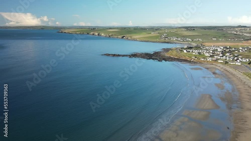 Wallpaper Mural Winter calm blue ocean and coastal sandy beach with small village in the distance, Ireland, aerial, Torontodigital.ca