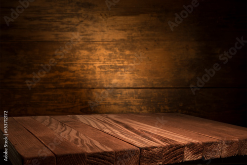 Excellent red wine bottles, wineglass, barrel and corkscrew on a rustic wooden table: traditional winemaking and wine tasting concept. High quality photo