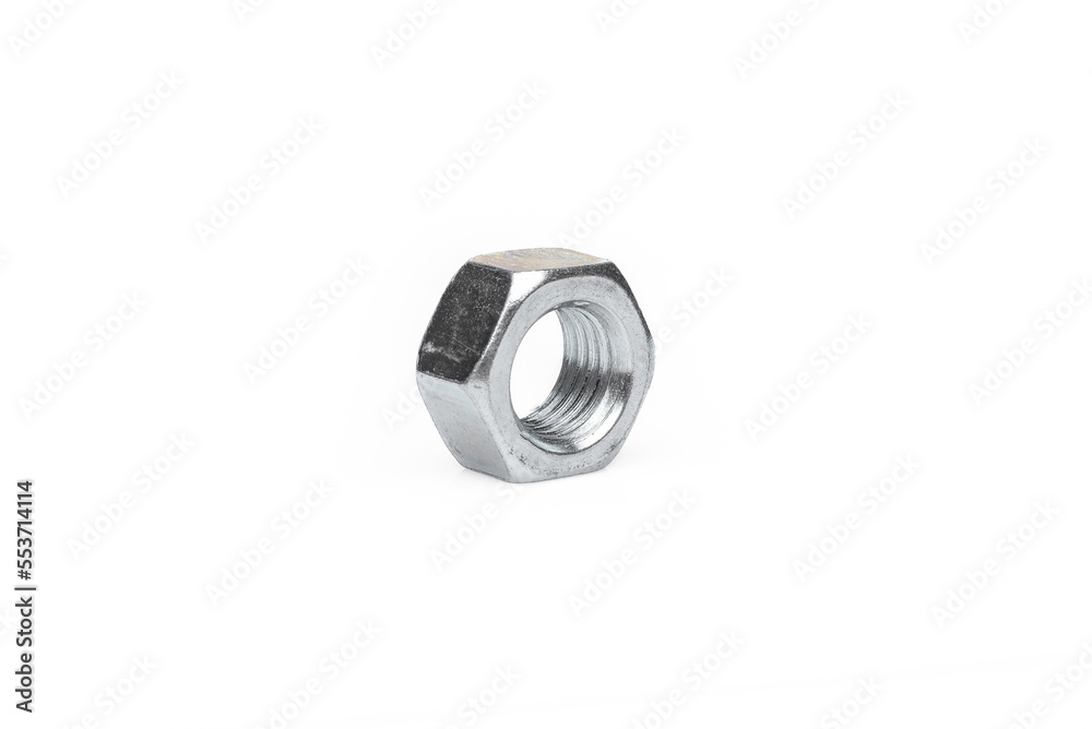 One steel nut. On an isolated white background. With scratches. Close-up studio macro photography. One steel nut. On an isolated white background. With scratches. Close-up studio macro photography.