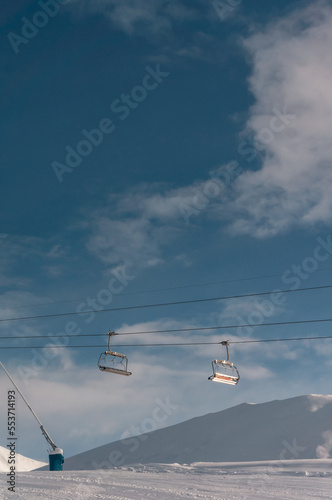 modern ski lift at winter at resort, alpine or caucasus gudauri mountains