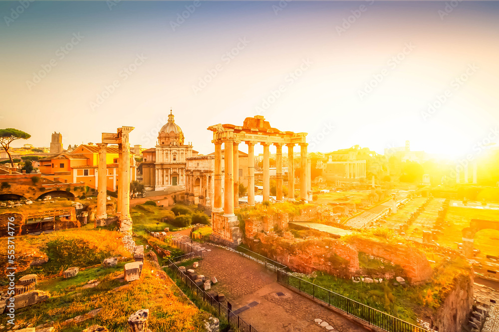 Forum - Roman ruins with cityscape of Rome with warm sunrire light, Italy