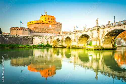 Photography famous castle saint Angelo and bridge over Tiber in sunset light, Rome, Italy