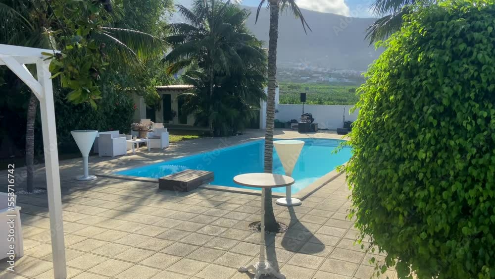 Incredible and luxurious outdoor pool in a villa overlooking the island of Tenerife on a sunny day. Spain Incredible and luxurious outdoor pool in a villa overlooking the island of Tenerife on a sunny day. Spain