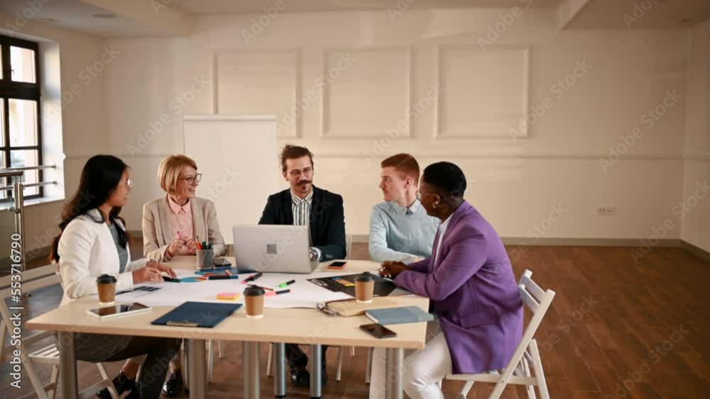 Multiracial business team working together while having a meeting in the office
Multiracial business team working together while having a meeting in the office