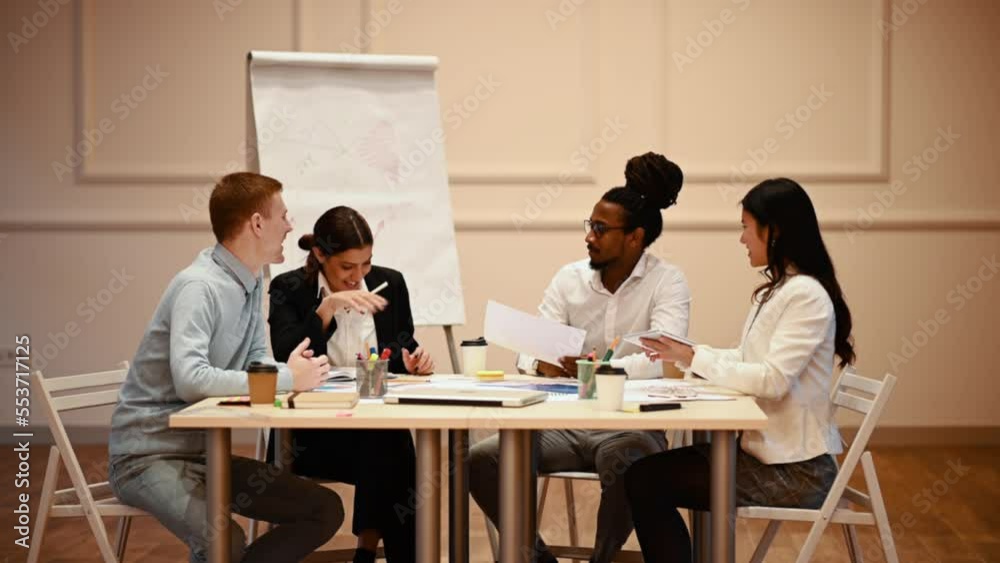 Multiracial business team working together while having a meeting in the office
Multiracial business team working together while having a meeting in the office
