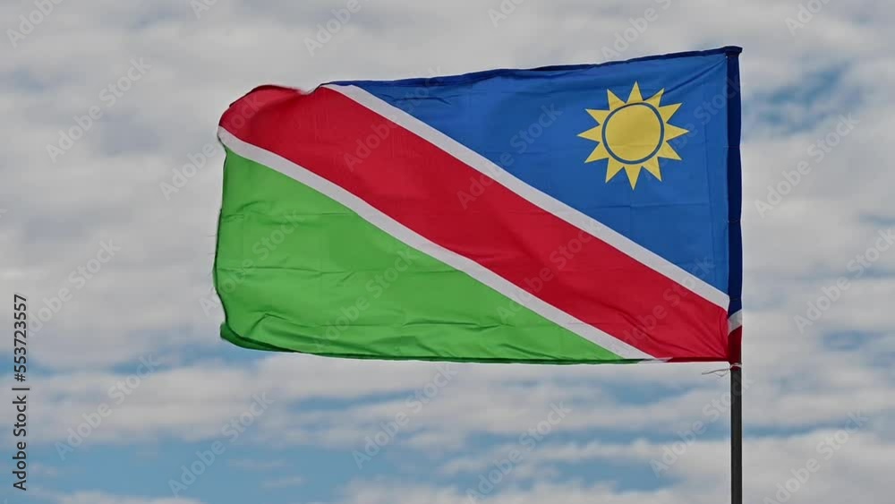 Closeup view of a Namibian flag waving in the wind