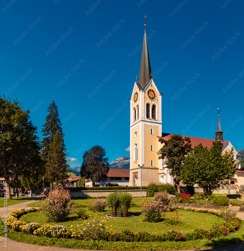 Fototapeta premium Beautiful church at the famous Kleinwalsertal valley, Riezlern, Vorarlberg, Austria