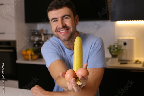 Humorous man presenting his breakfast ingredients  photo