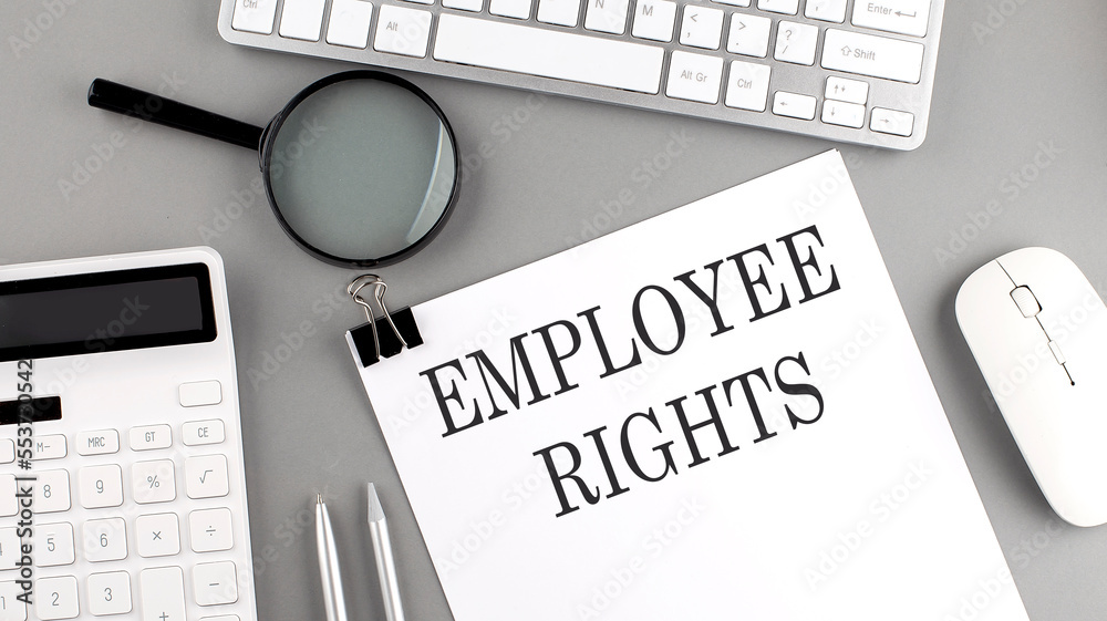 Αυτοκόλλητο EMPLOYEE RIGHTS written on paper with office tools and keyboard on the grey back