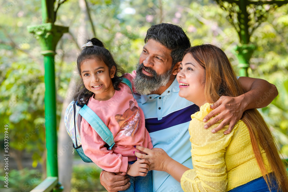 Happy indian couple with his little girl at garden. Stock Photo | Adobe ...