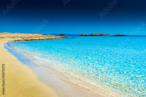 Fototapeta Naklejka Na Ścianę i Meble -  Amazing crystal clear water of Manganari beach, Ios Island,  Greece