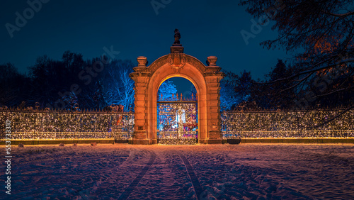 Fotografie Lightened main entrance gate of Silesian Zoological Garden located in Silesian Park, Chorzow, Poland