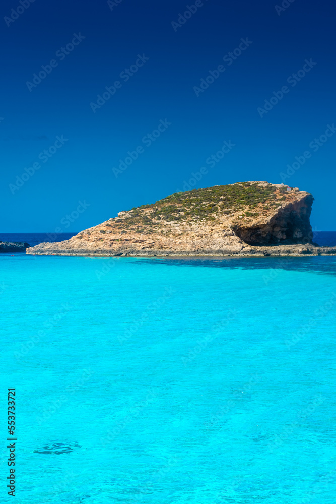 Amazing crystal clear water in the Blue Lagoon of Comino Island, Malta Amazing crystal clear water in the Blue Lagoon of Comino Island, Malta