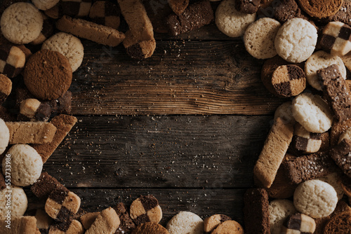Various biscuits on wooden background photo