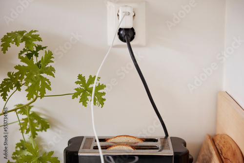 Toaster plugged into an outlet photo