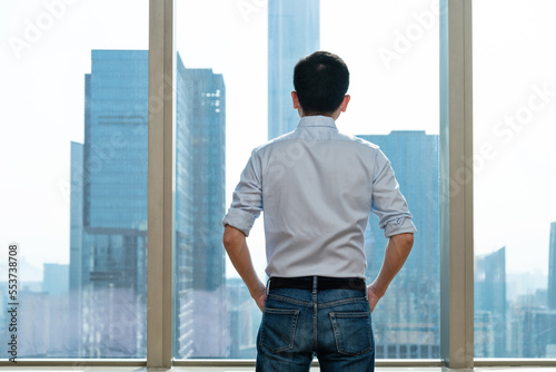 Businessman standing in front of the window