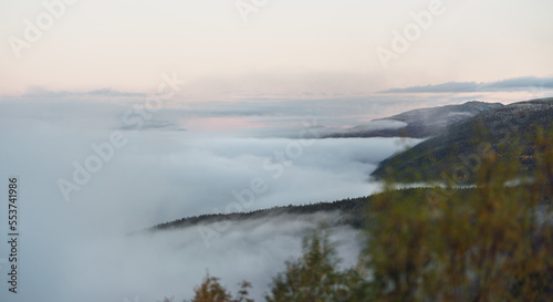 foggy mountain scenery and morning mist during sunrise. landscape and fall concept.