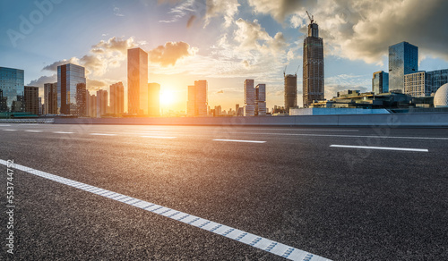 Fototapeta Naklejka Na Ścianę i Meble -  Asphalt road and modern city skyline with buildings in Ningbo, Zhejiang Province, China.