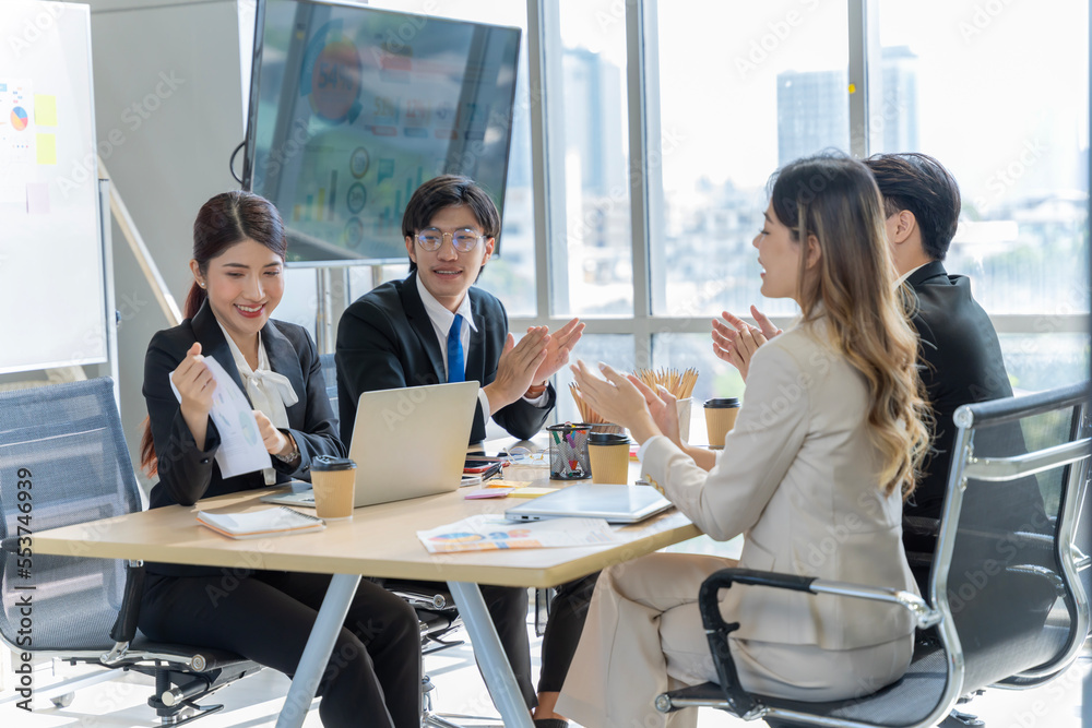 A group of young Asian businessmen Talking and planning work happily and have fun. at the company's office