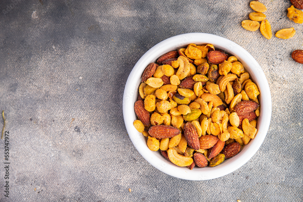 nuts mix almonds, cashews, pistachios, peanuts fresh healthy meal food snack on the table copy space food background rustic top view nuts mix almonds, cashews, pistachios, peanuts fresh healthy meal food snack on the table copy space food background rustic top view