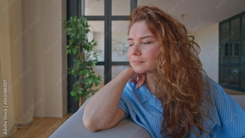 adult woman enjoy day at home sitting on the couch looking through the window dreaming relaxing in the morning adult woman enjoy day at home sitting on the couch looking through the window dreaming relaxing in the morning