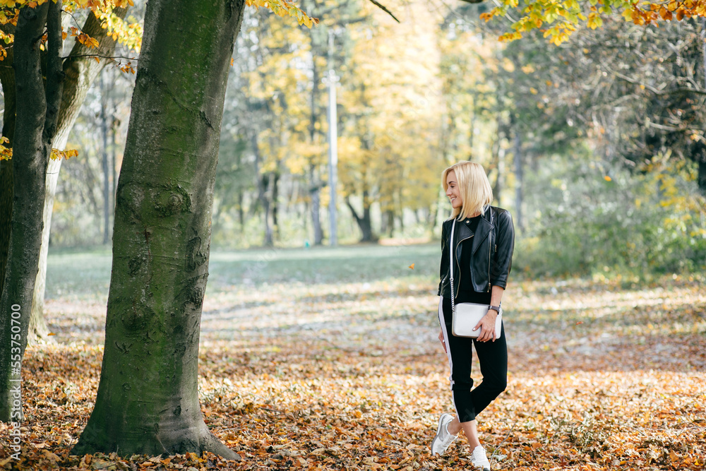 young girl walking in autumn park young girl walking in autumn park