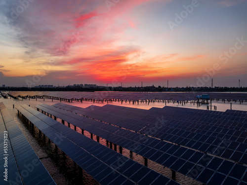 Solar power station at beautiful sunset. solar photovoltaic power station on water. green energy concept. © ABCDstock
