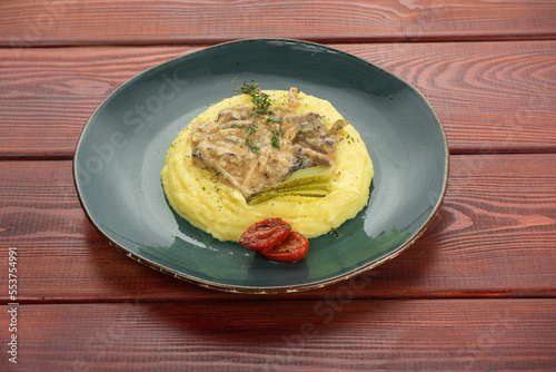 Greek Sofrito Traditional Beef Dish with mashed potatoes from Corfu with mashed potatoes closeup in the plate on the table