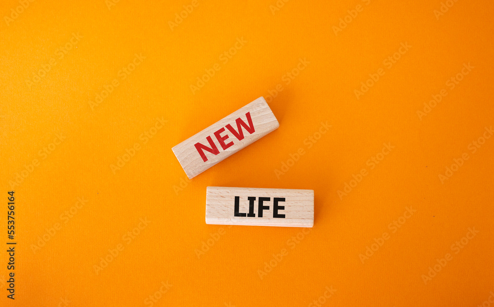 New life symbol. Wooden blocks with words New life. Beautiful orange background. Business and New life concept. Copy space. New life symbol. Wooden blocks with words New life. Beautiful orange background. Business and New life concept. Copy space.
