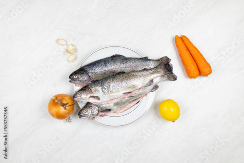 Fresh trout on the plate ready for preparing